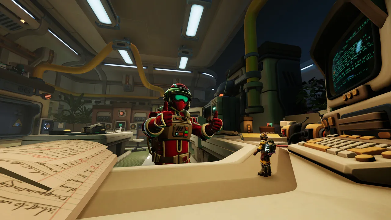 An explorer gives two thumbs up across a laboratory desk filled with papers and equipment.
